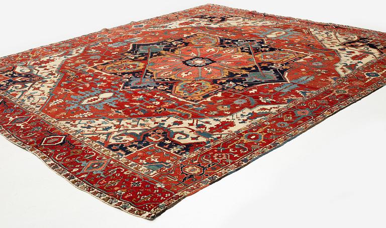 An antique Heriz Serapi carpet, north west persia, c 400-405 x 337 cm.