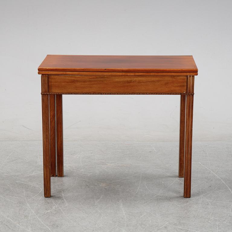 A mahogany games table, circa 1800.