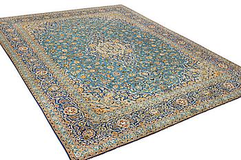 A Kashan carpet, signed Isfahanian, a. 407 x 310 cm.