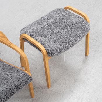 An Yngve Ekström armchair with footstool, "Lamino", Swedese, 21st century.