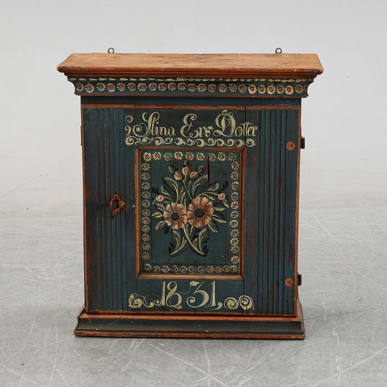 A Swedish painted cabinet from Hälsingland, dated 1831.