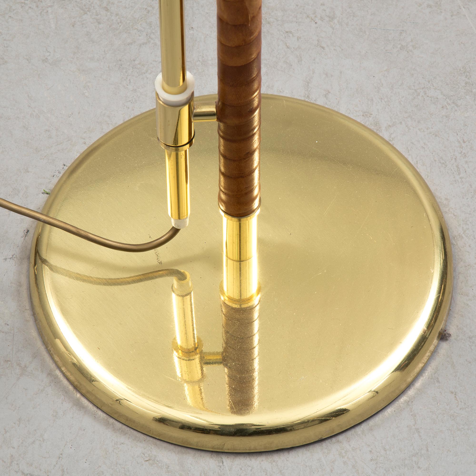 A brass and leather floor light by Örsjö industri, 21st century.