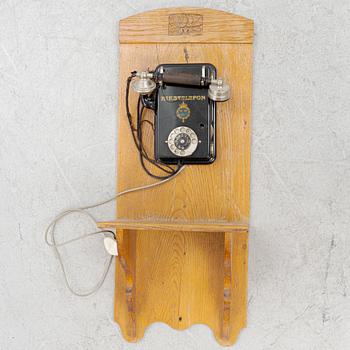 A wall mounted telphone, early 20th century.