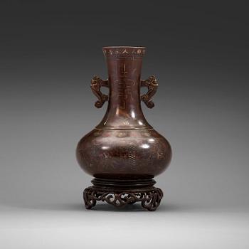 A bronze vase with stand, Qing dynasty (1644-1912).