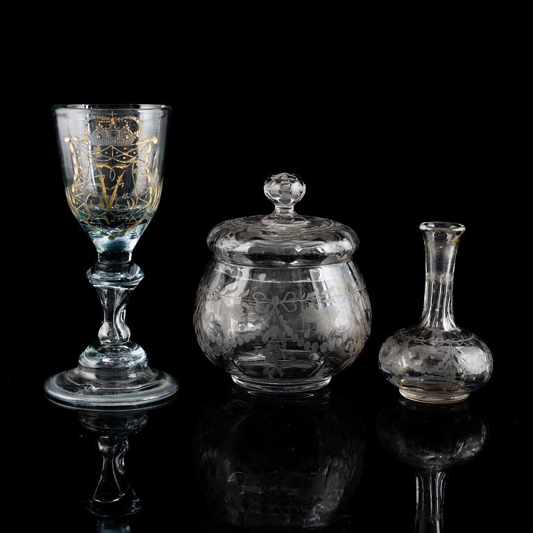 GLASS ITEMS, 3 pieces. Wineglass, 18th Century, a glass bowl with lid and a minature vase. All engraved.