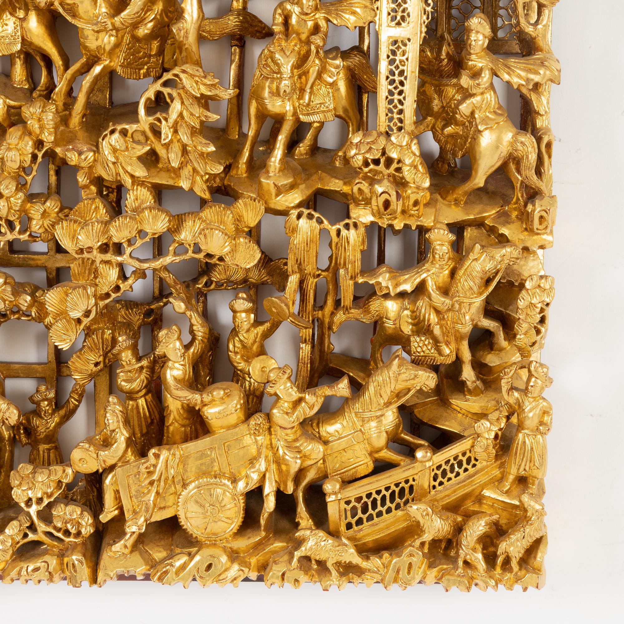 A carved Chinese wooden panel, late Qing dynasty, circa 1900.