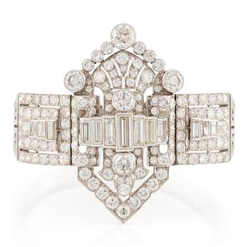 631. A bracelet in platinum set with baguette and brilliant-cut diamonds, Art Déco.