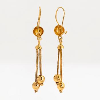 A pair of 21K gold earrings.