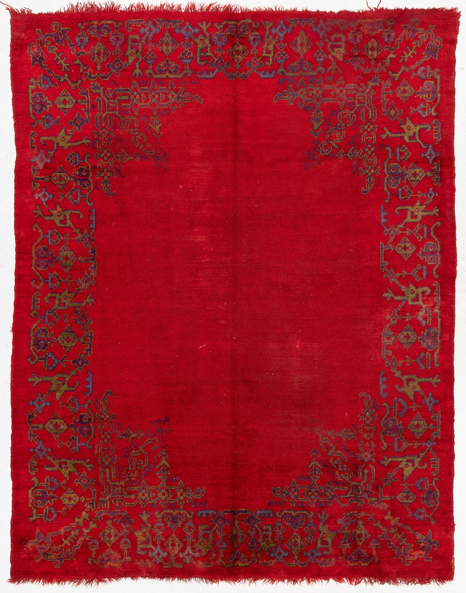 An antique Ushak carpet, West Anatolia, approx. 327 x 250.