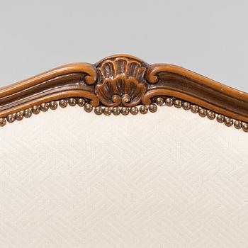 A pair of Rococo style armchairs, later part of the 20th century.