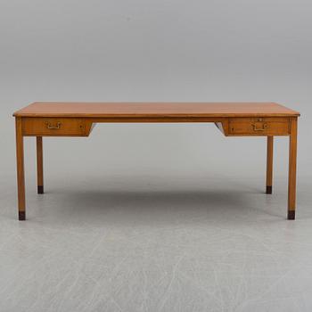 A teak veneered desk, 1950's.