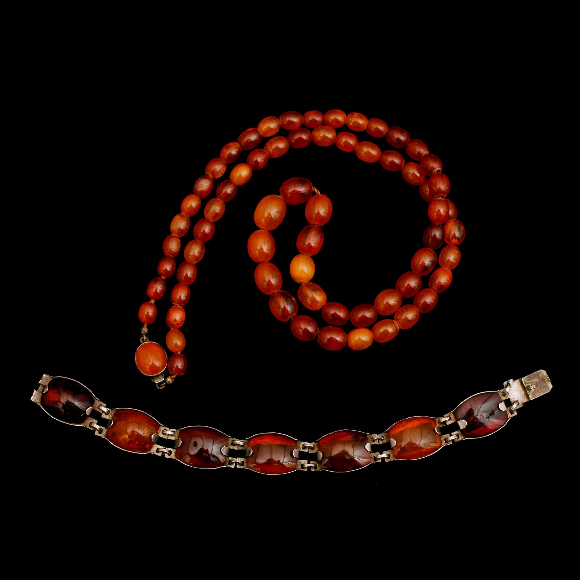 HALSBAND OCH ARMBAND, silver och bärnsten, 1900-tal.