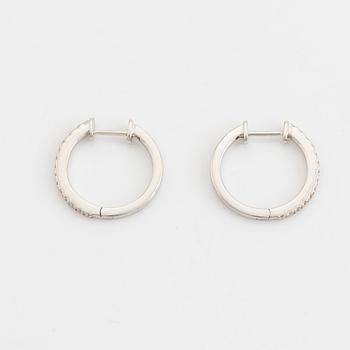 Brilliant cut diamond hoop earrings.