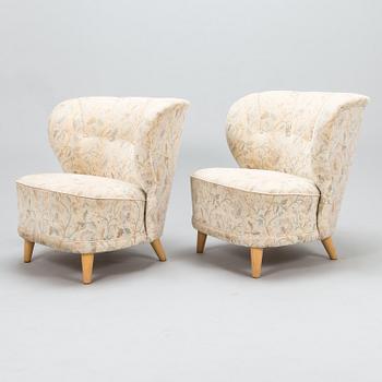 A pair of mid 20th century armchairs.