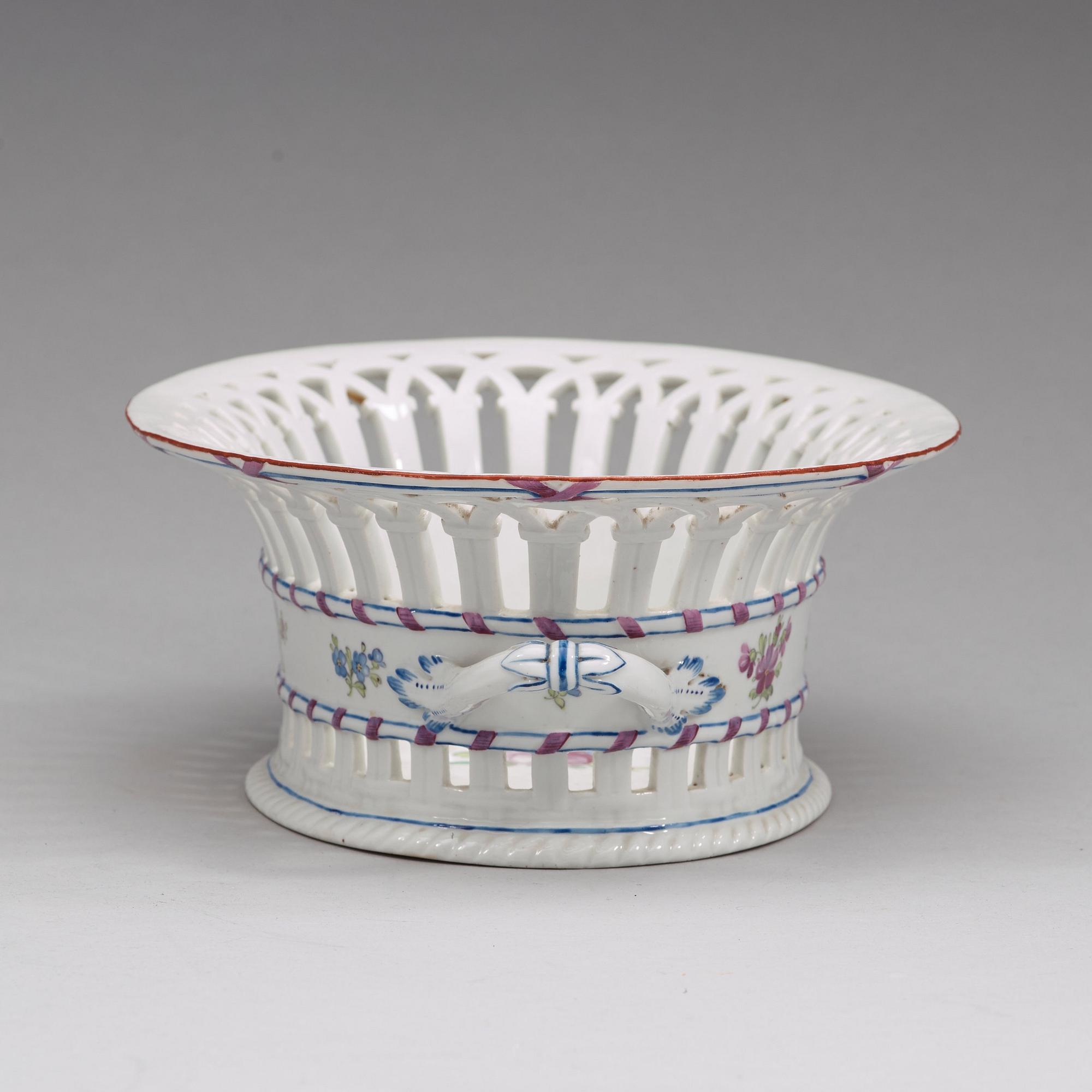 A Russian chesnut basket and stand, Imperial Porcelain Manufactory, St Petersburg, period of Alexander I (1801-25).