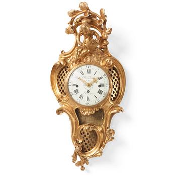 103. A French Louis XV ormolu cartel clock marked Baudin à Paris, mid 18th century.