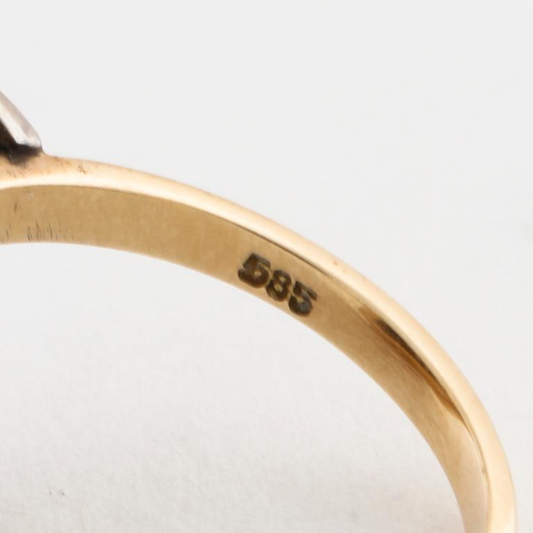 A facet cut diamond ring.