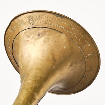 A brass hunting horn by Pierre Raoux (manufacturer of horns in Nancy, fl. ca 1723 -1789.).