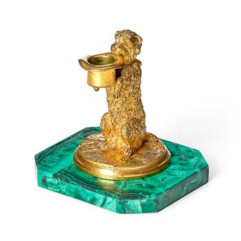 178. A Russian Nicholas II malachite-veneered and gilt-bronze candlestick, late 19th century.