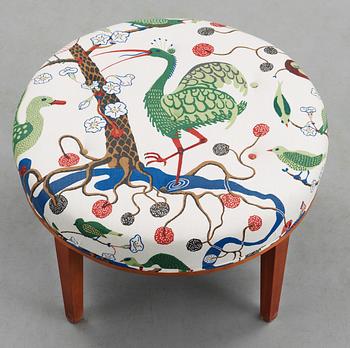 A Josef Frank cherrywood stool by Svenskt Tenn, model 647.