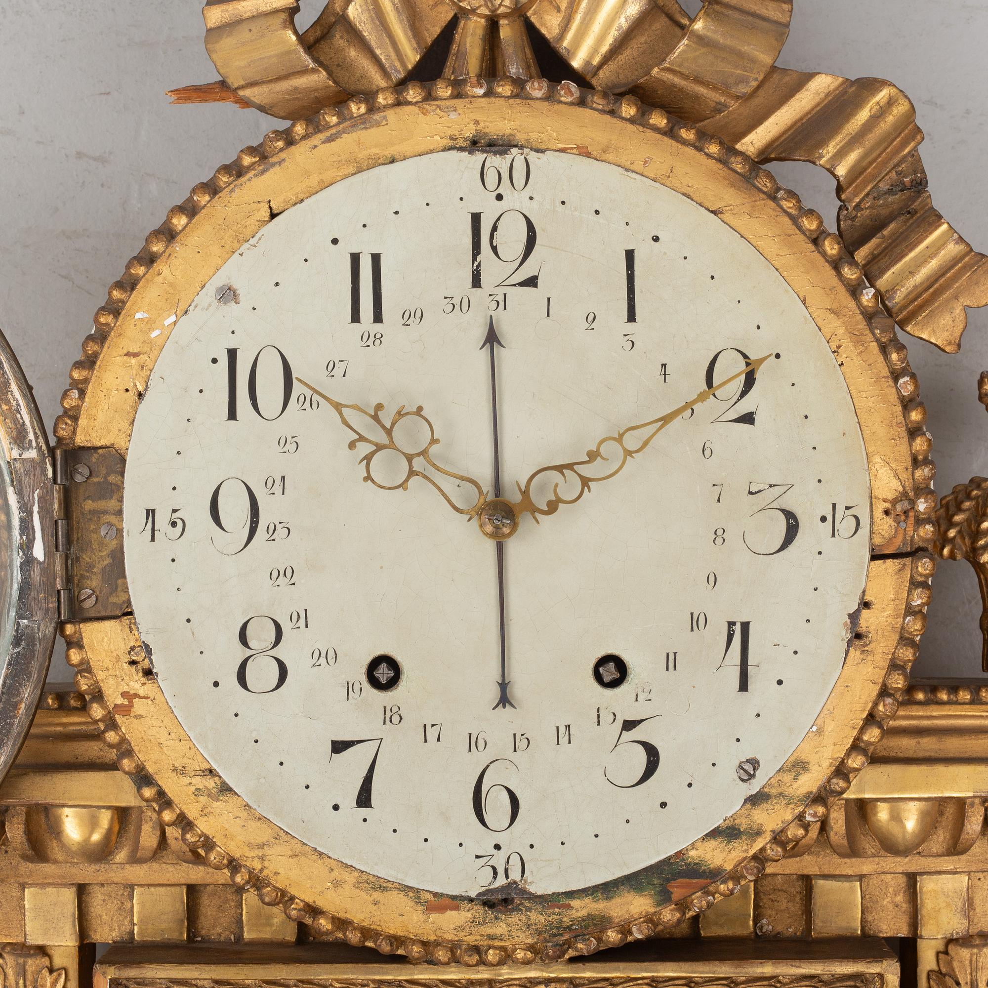 A Gustavian wall clock, late 18th century.