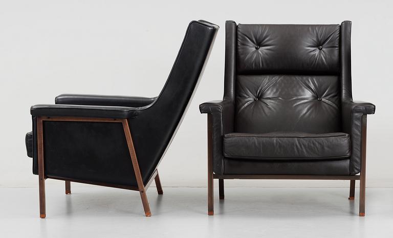 A pair of Karl- Erik Ekselius black leather armchairs, JOC, Vetlanda early 1960's.