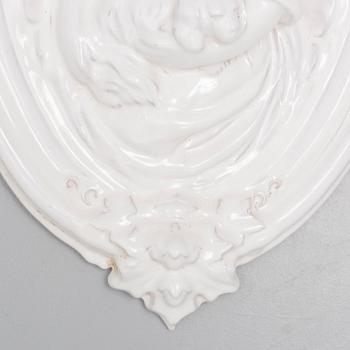 A ceramic wall relief, circa 1900.