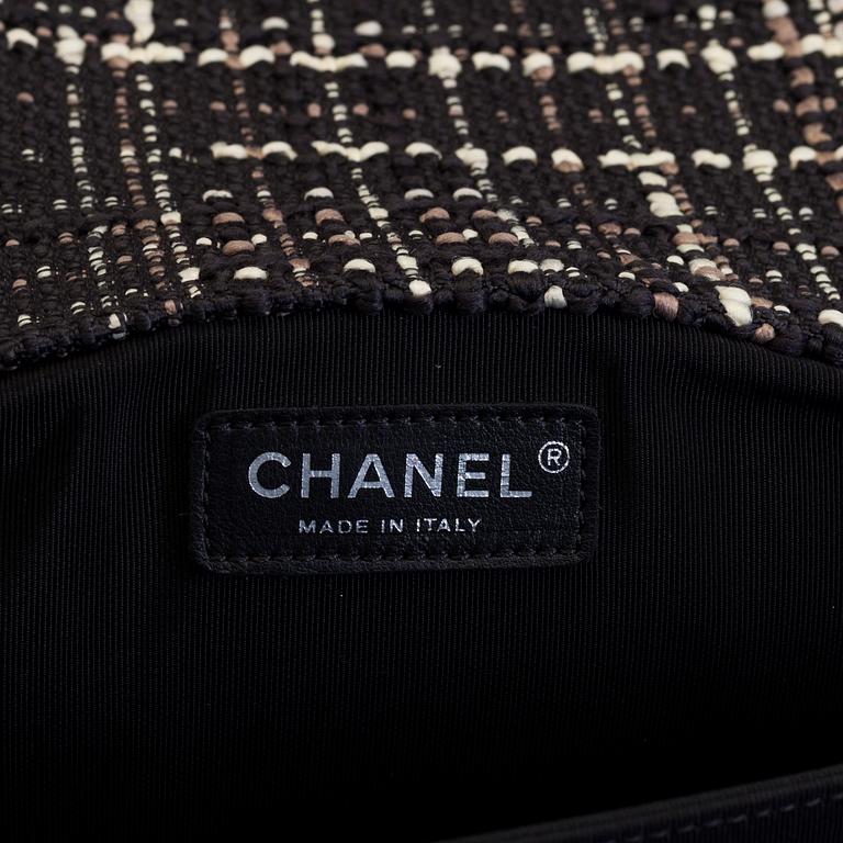A tweed bag "Classic flip bag XL" by Chanel from 2016-2017.
