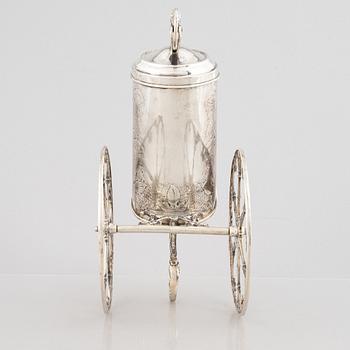 A silver bottle holder with wheels, 20th Century.