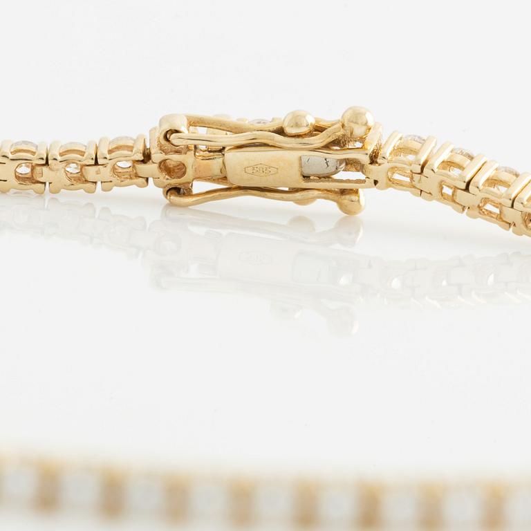 Tennis bracelet, 14K gold with brilliant-cut diamonds.