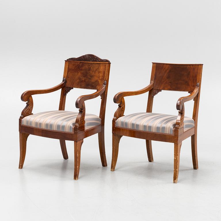 A pair of Russian carved mahogany Empire armchairs, first half of the 19th Century.