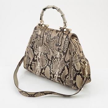 Gucci, a 'Pop Bamboo' python bag.
