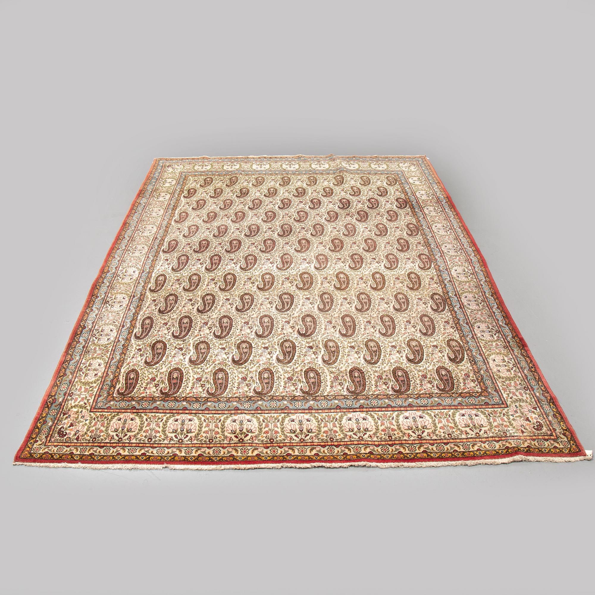 A CARPET, semi-antique Qum, ca 341 x 238 cm.