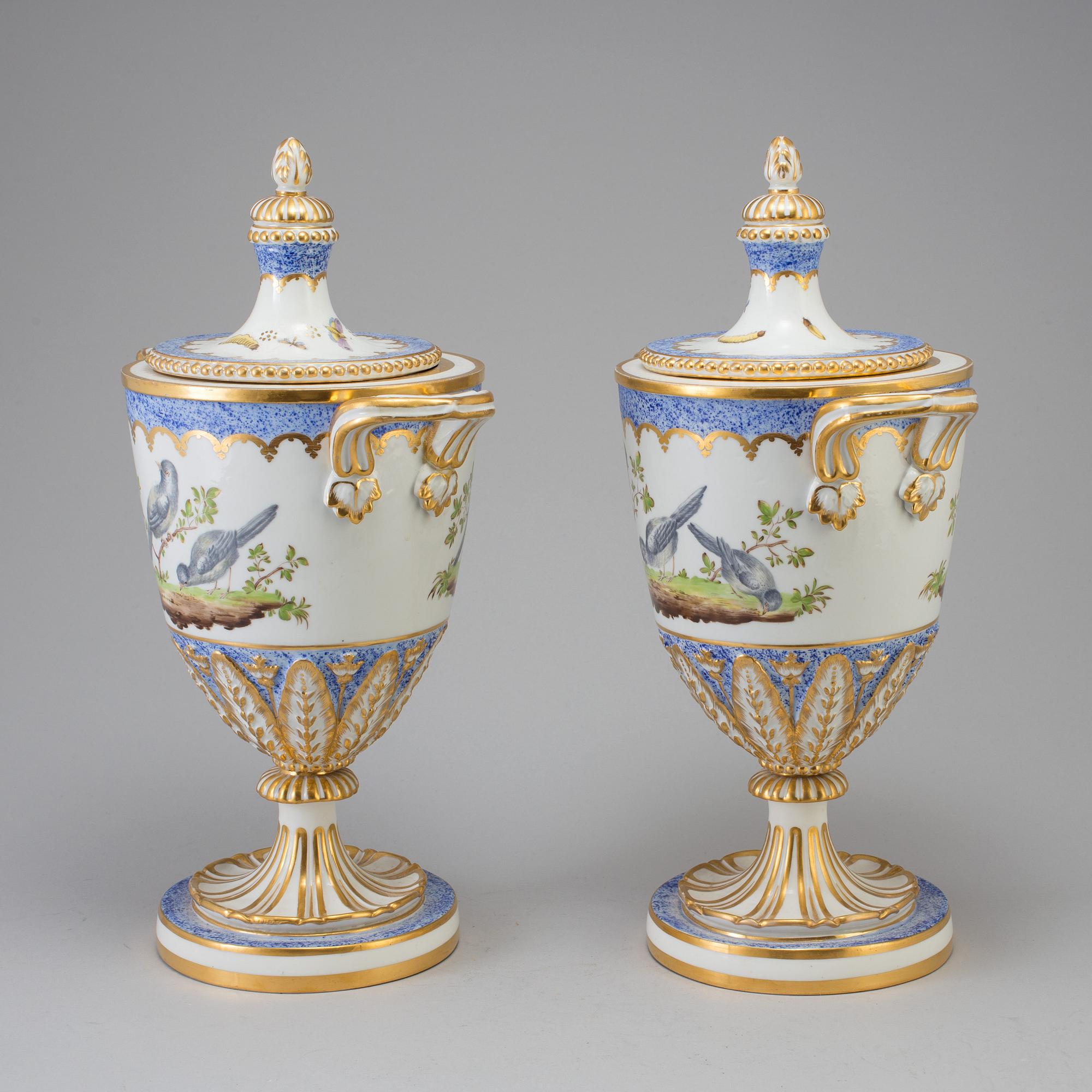 A pair of French 19th century porcelaine 
lidded vases with Sèvres style mark.