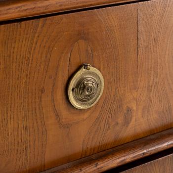 A Gustavian style oak veneered chest of drawers, around 1900.