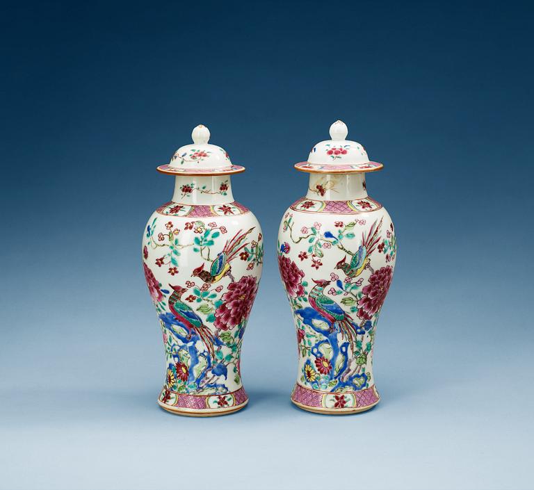 A pair of famille rose vases with covers, Qing dynasty (1736-95).