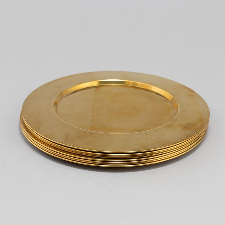 Eight brass plates by Stelton, Denmark, second half of the 20th century.