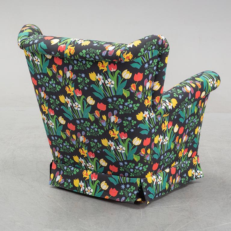 A sofa and wingback chair, later part of the 20th Century.