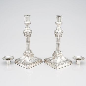 An English pair of 18th Century silver candlesticks, mark of John Winter & Co, Sheffield 1775.