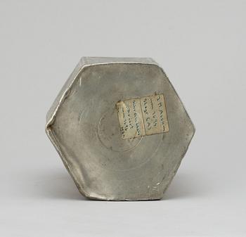 A pewter bottle. Unidentified marks.
