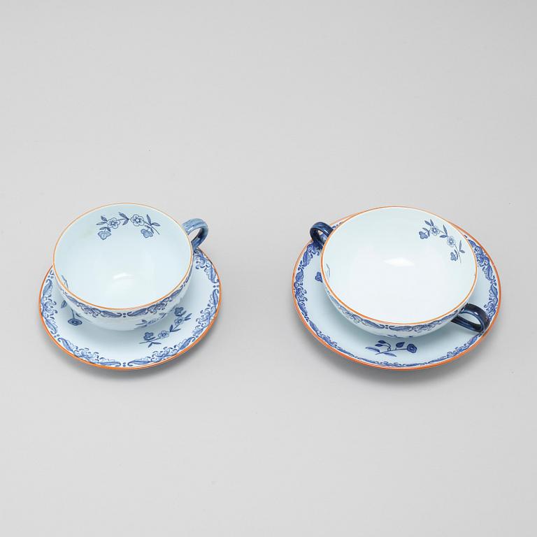 Seven "Ostindia" broth cups with sausers and chocolate cups with sausers in earthenware, Rörstrand, 20th century.