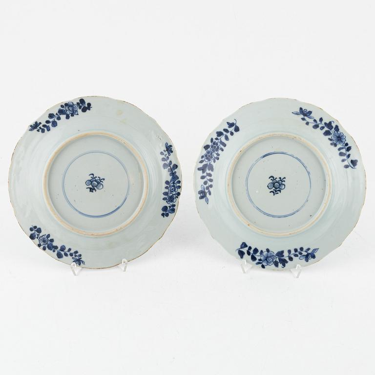 A set of four blue and white dinner plates, Qing dynasty, 18th Century.