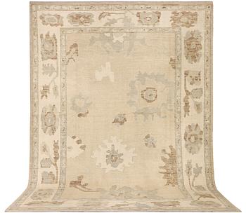 An Ushak Design carpet, a. 426 x 307 cm.