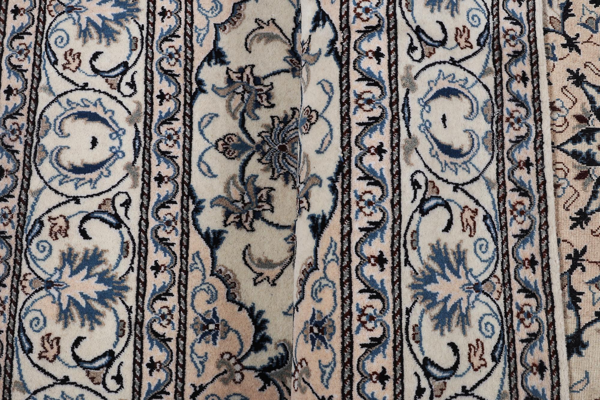 A rug, Nain, part silk, ca 200 x 195 cm.