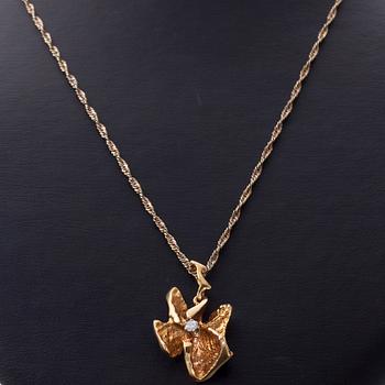 HÄNGE, 14K guld, briljantslipad diamant. Åbo, 1983. Vikt ca 9,1 g.