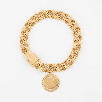 Bracelet, 18K gold Bismarck link, with charm.