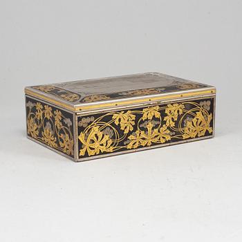 A steel and brass cigarr box by Emil Olsson Eskilstuna around 1900.