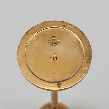 Pierre Forssell, A set of three 'Tulip' brass candlesticks by Skultuna Bruk, 1993.