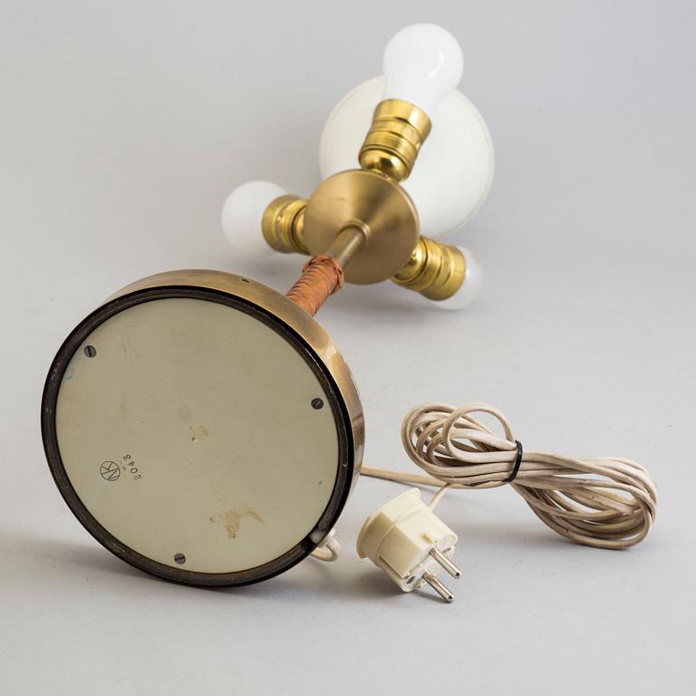 A brass and leather table light from Nordiska Kompaniet, mid 20th Century.