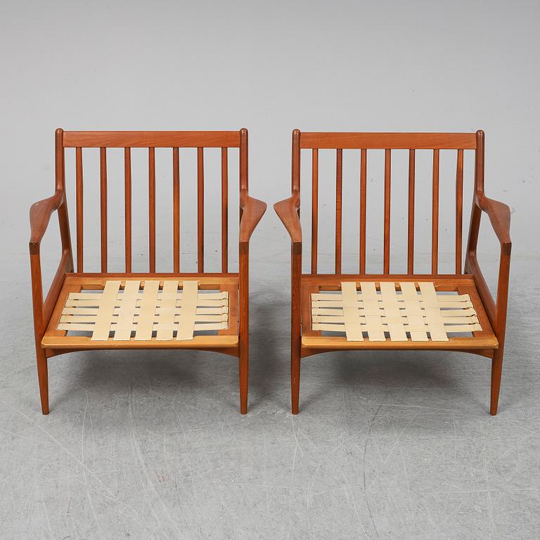 A pair of late 20th Century easy chairs.